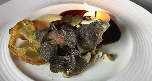 A Bar N Imperial Texas Wagyu Strip Loin on Salsify Puree with Pickled Beech Mushrooms, Truffle Jus and a Beef Fat Candle–edible