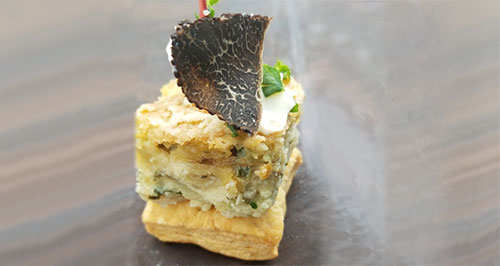 Truffle Quiche with potatoes, kale and Fontina cheese