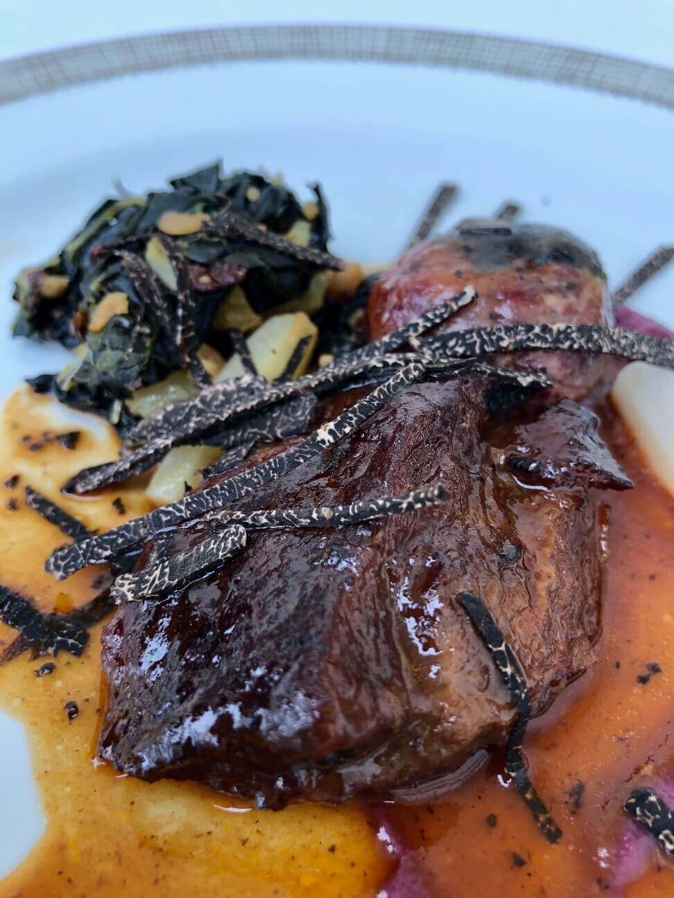 Braised Veal Cheek with Veal Crepinette, Red Cabbage Puree, Cavallo Nero, Onion & Black Truffles